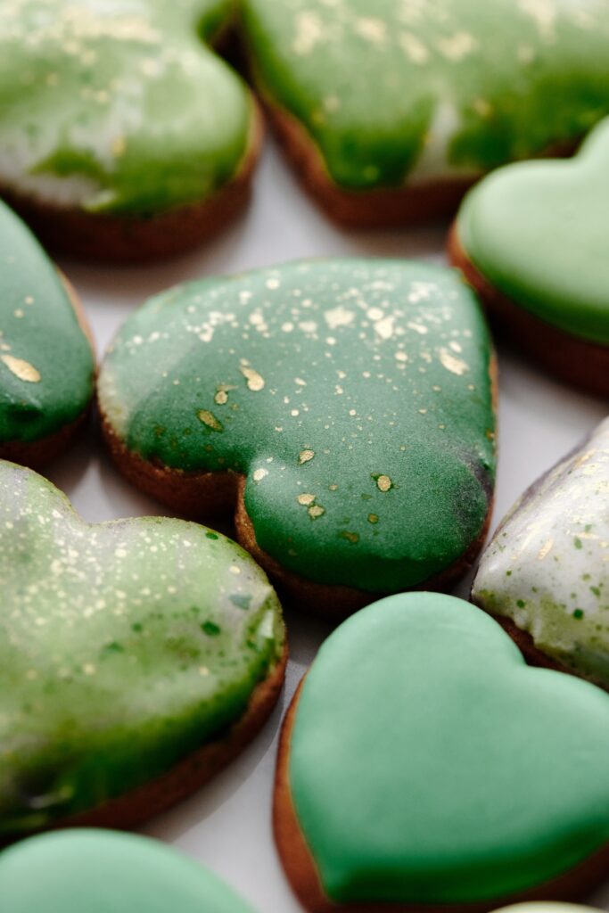 heart cookies with simple royal icing green with gold splatter